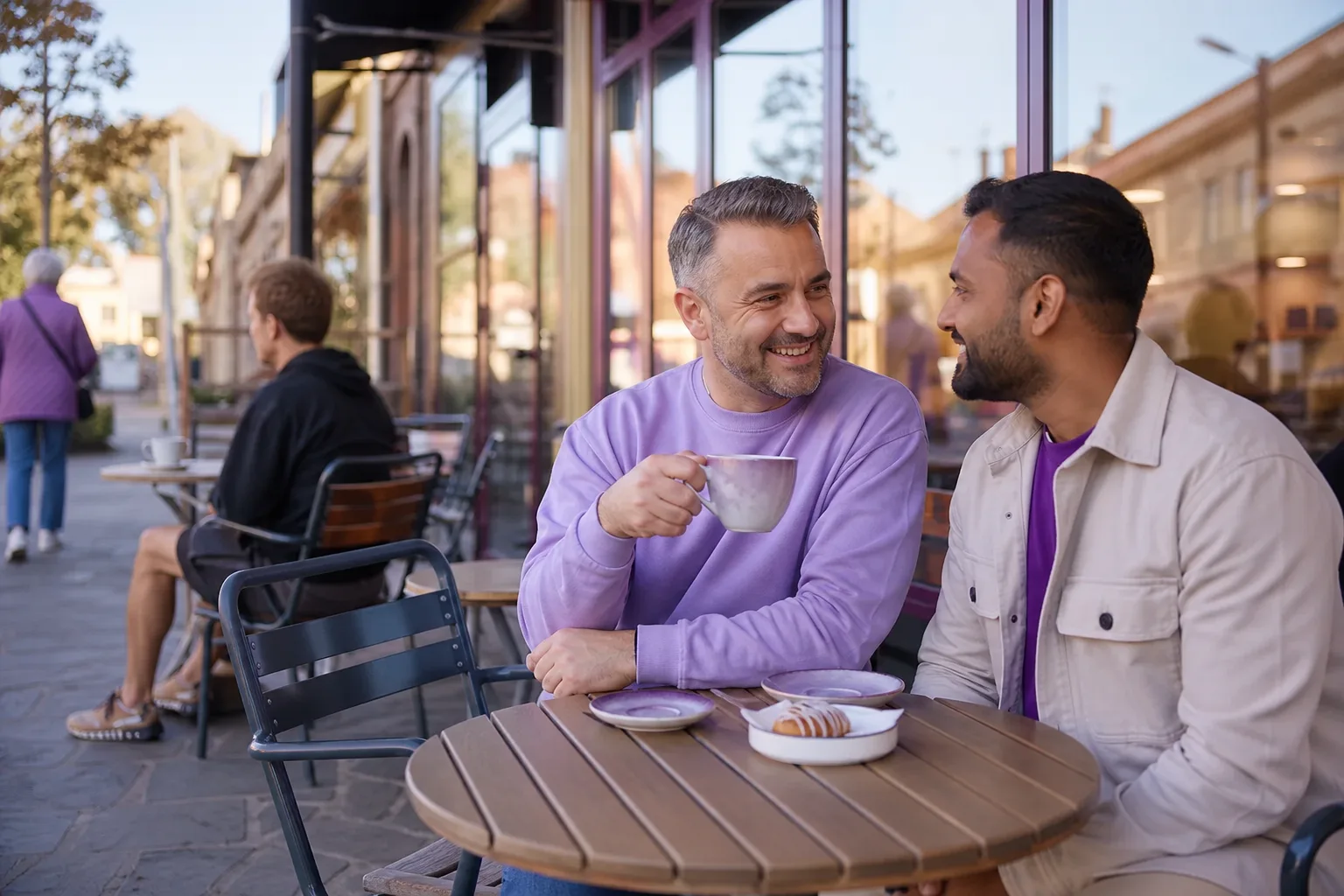 Two men talking over coffee in Grantham town centre